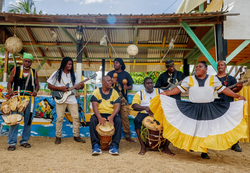 Members of the Belize local band, Garifuna Collective performing.