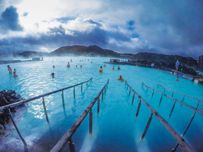 People relax in the geothermal hot springs at Blue Lagoon. Iceland