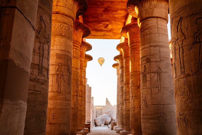 Balloons take to the sky at dawn above Pharaoh Ramesses II memorial temple in Theban Necropolis, Upper Egypt