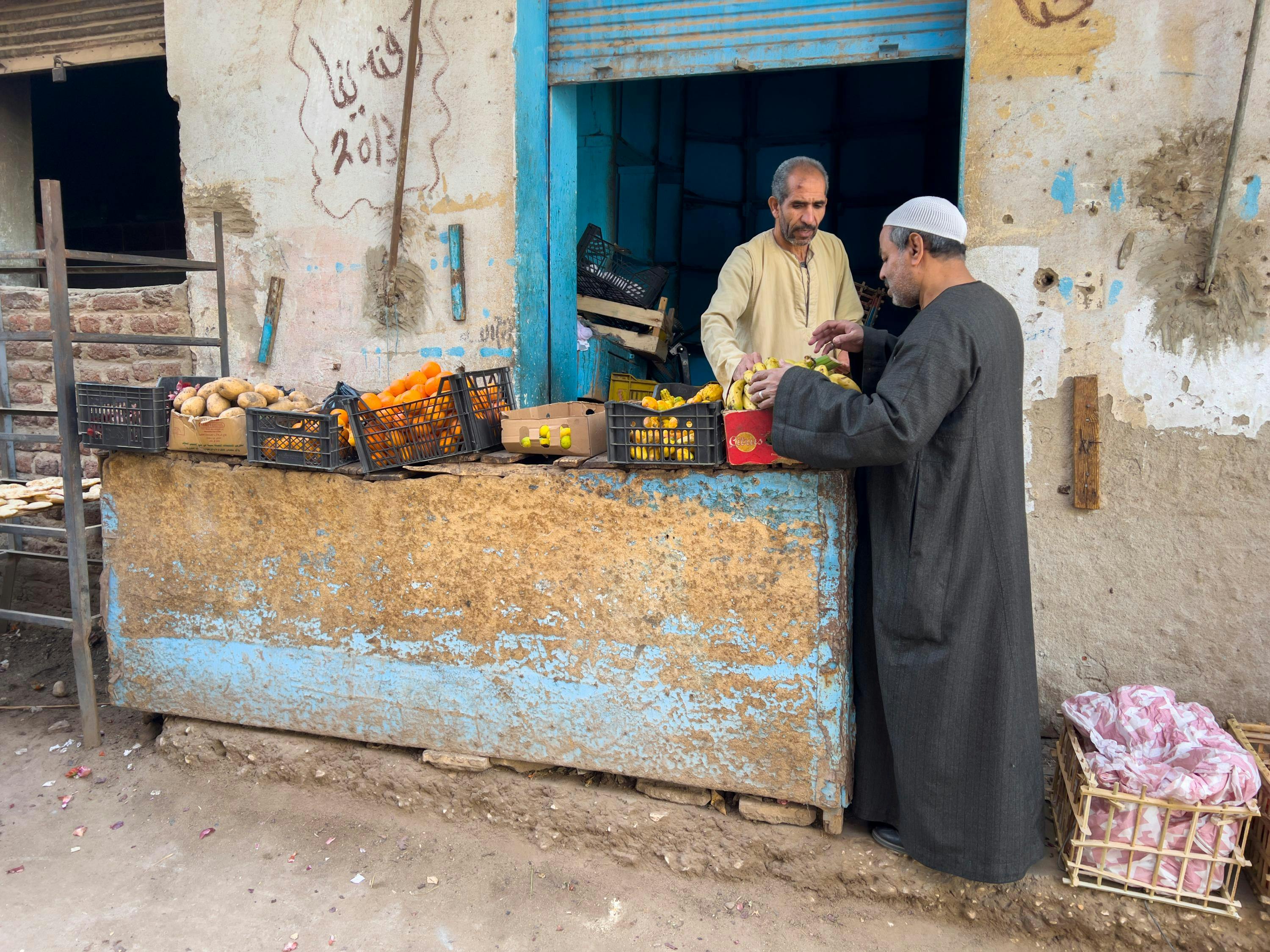 Egyptian street vendors near the Temple of Khnum, lying beneath the contemporary town of Esna, Egypt.