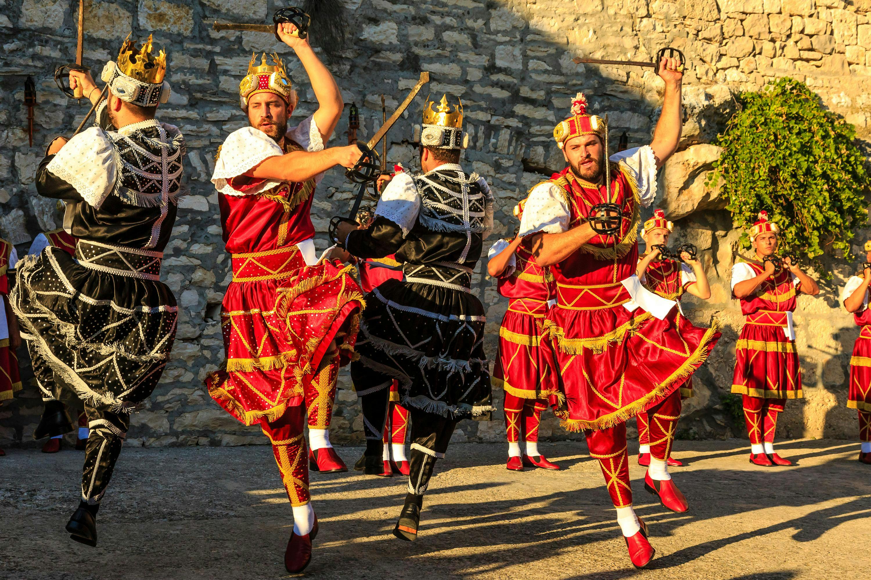 Locals preform the Moreska Sword Dance in Old Town Korcula, Dalmatian, Croatia.