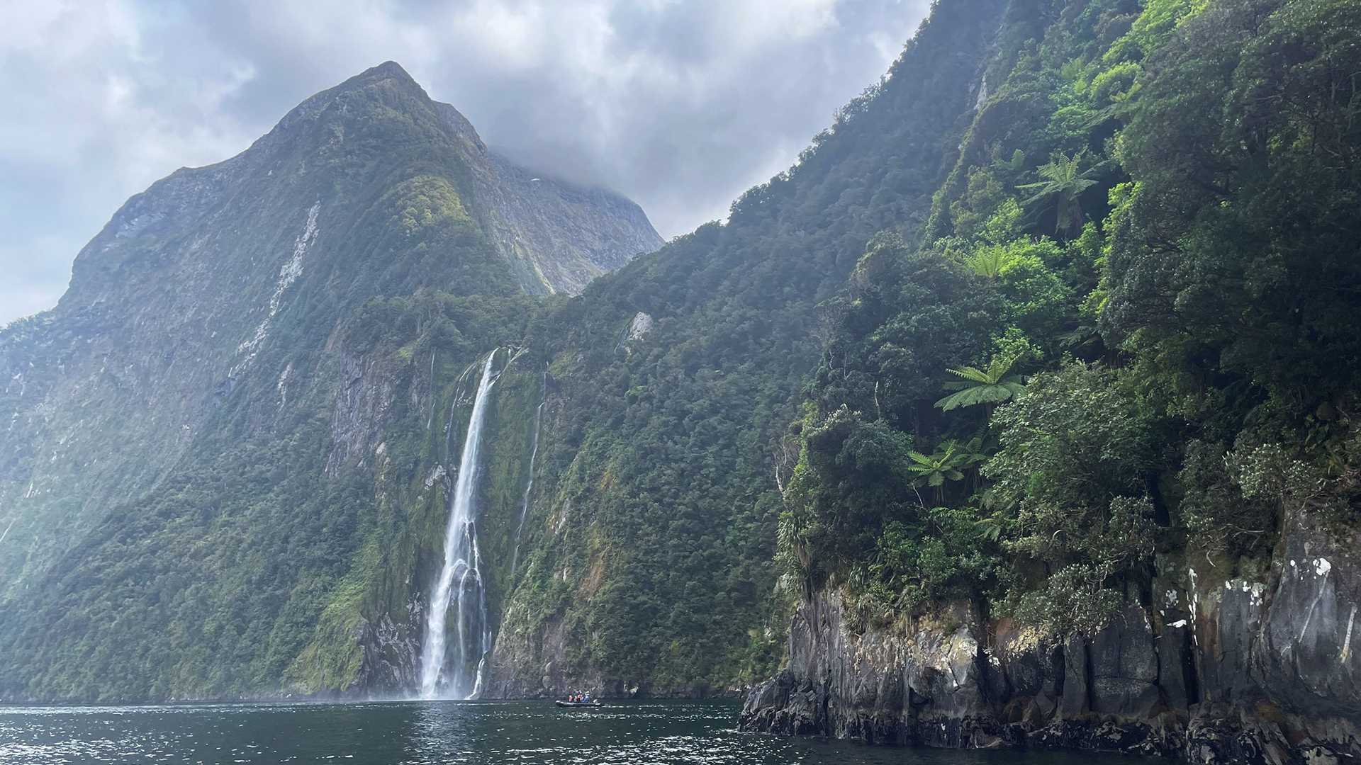 a waterfall in Milford Sound, New Zealand