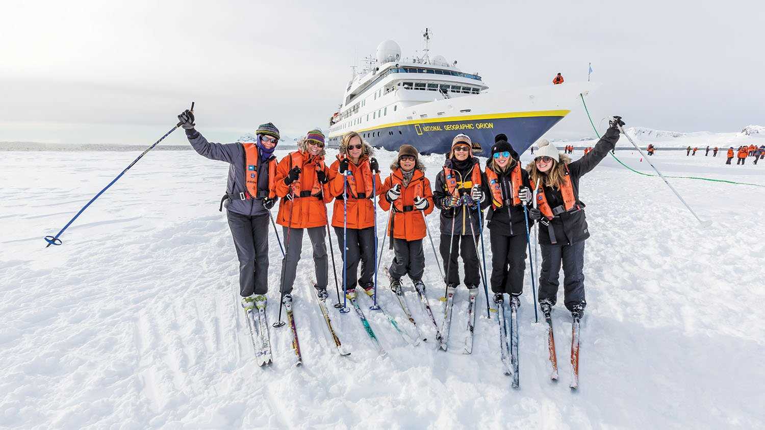 A group of guests pose on Antarctic Ice