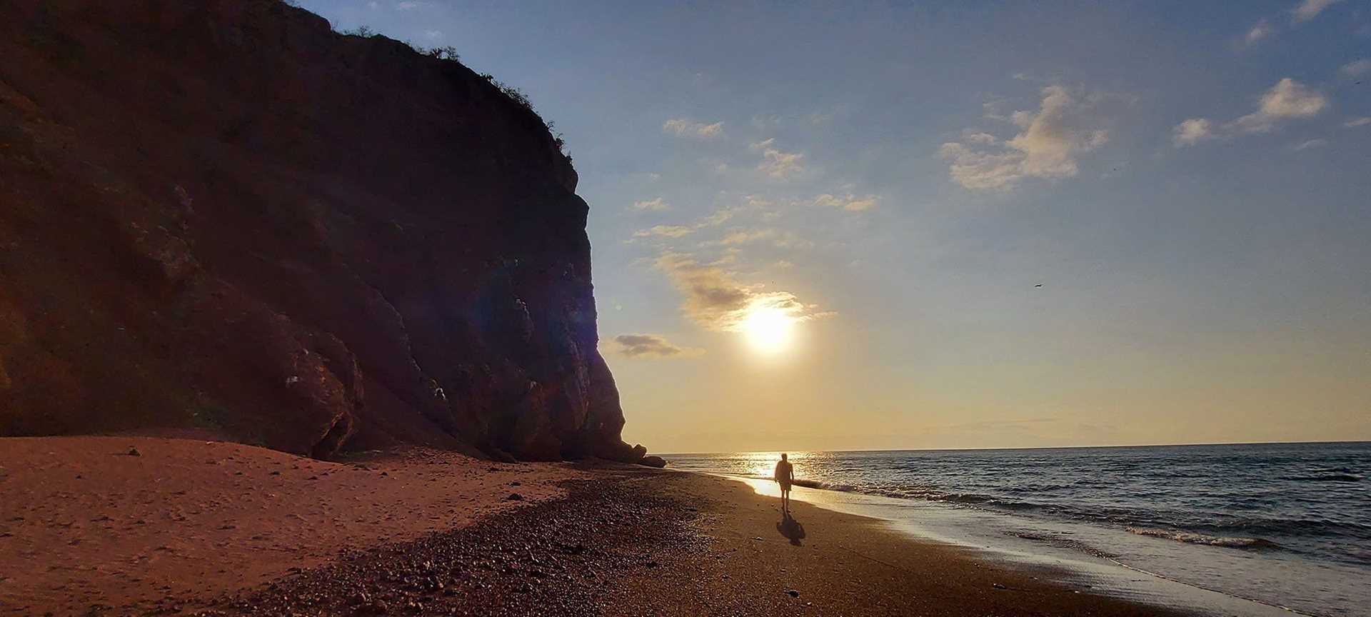 sunset on red sand beachj