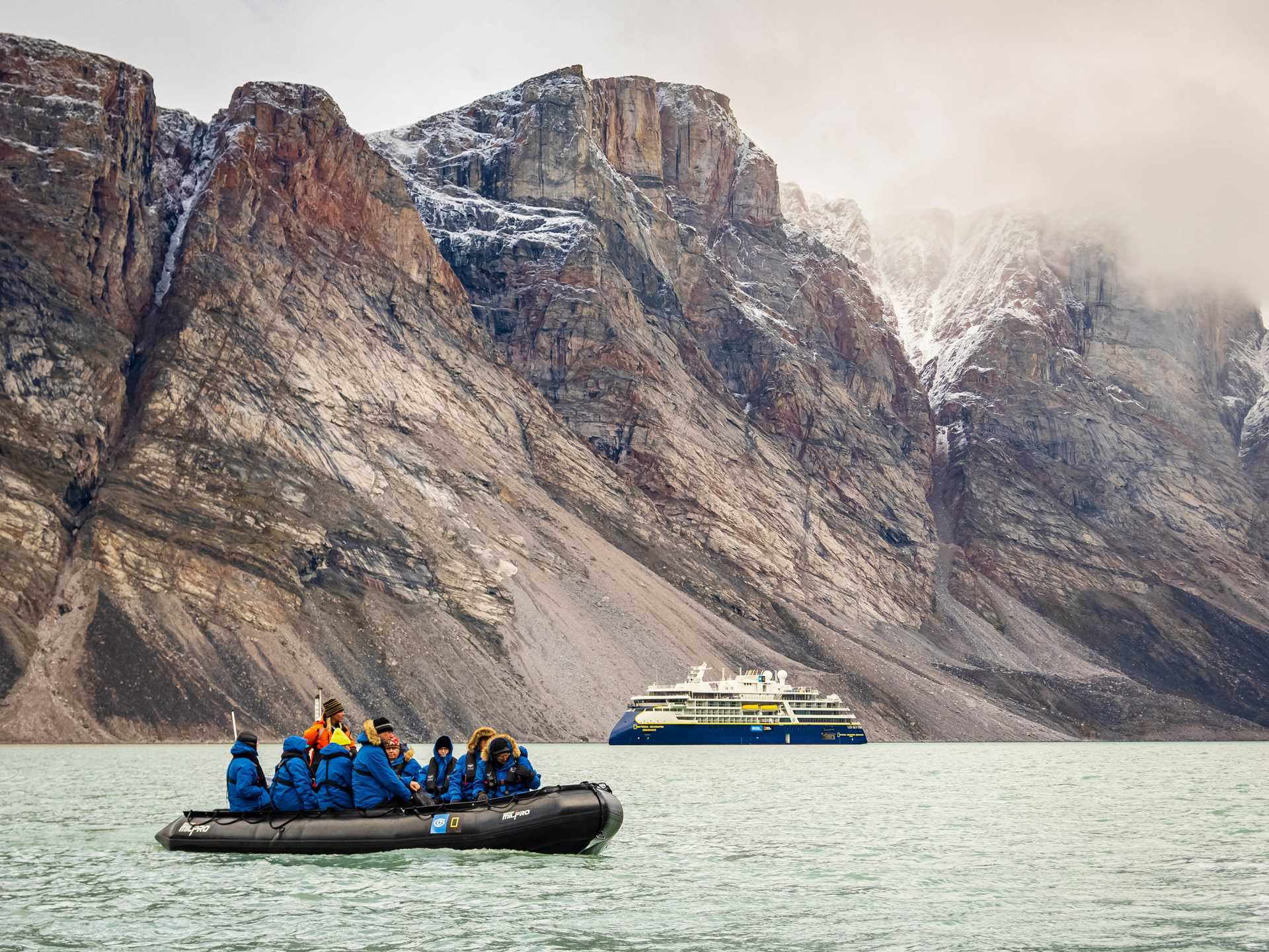 Guests explore by Zodiac from the ship National Geographic Endurance in Buchan Gulf, Baffin Island, Nunavut, Canada.